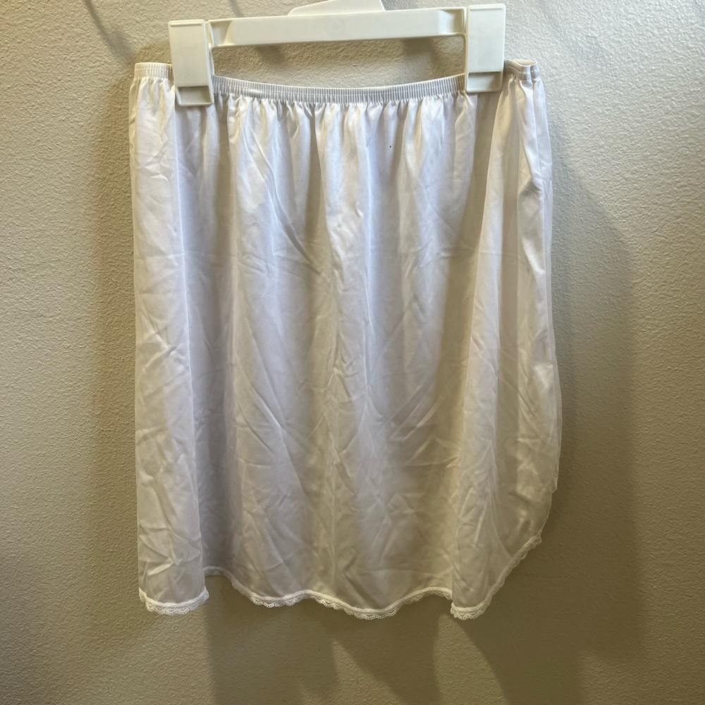 White vanity fair slip with a side slit size 18”